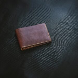 Vintage Wallet against black leather backdrop