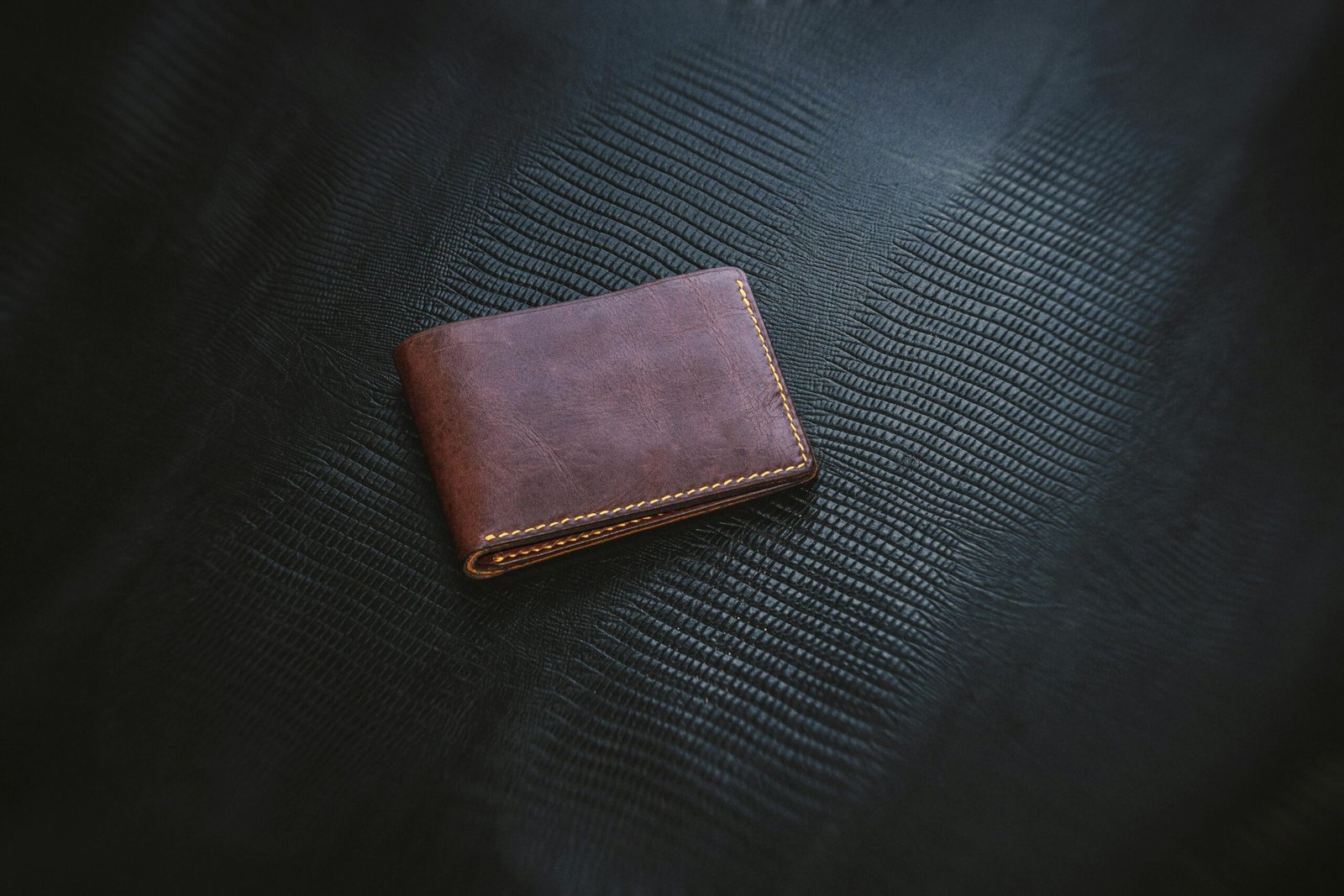Vintage Wallet against black leather backdrop